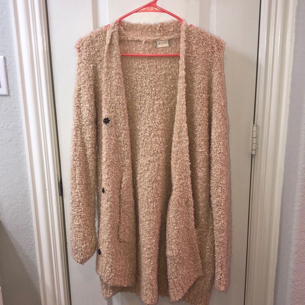 A long beige cardigan
